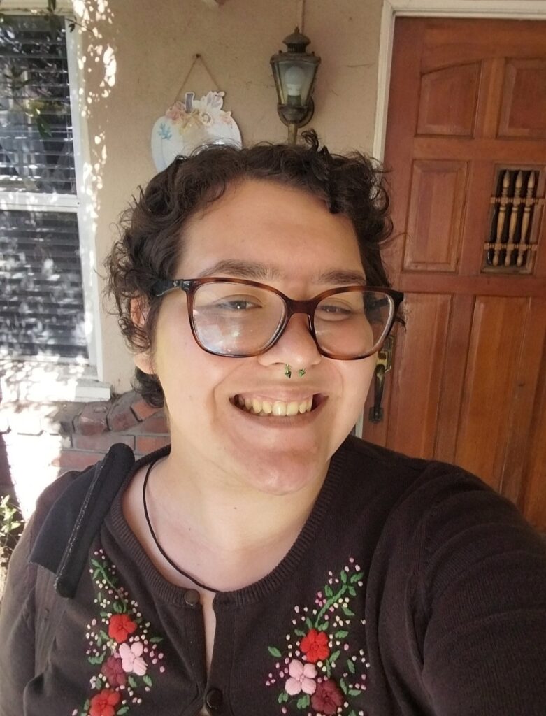 A photograph of Alyssa Perez, Librarian Intern at Sherman Library & Gardens